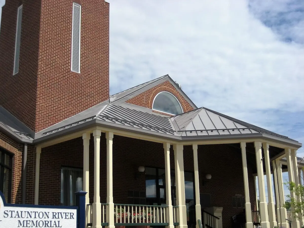 Skilled roofing craftsmen working on a residential roof in Stony Brook